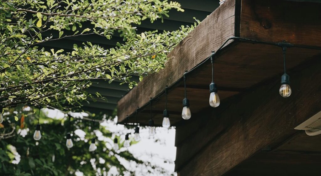 string lights on pergola steps